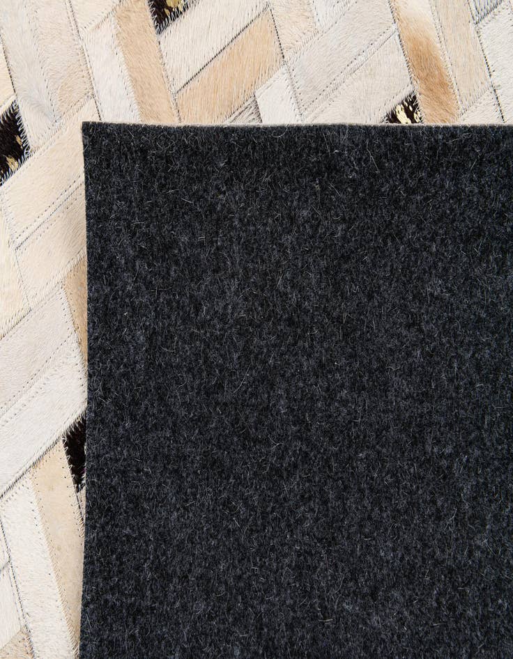 Detail image of 5' 1 x 8' Cowhide Stocks Rug
