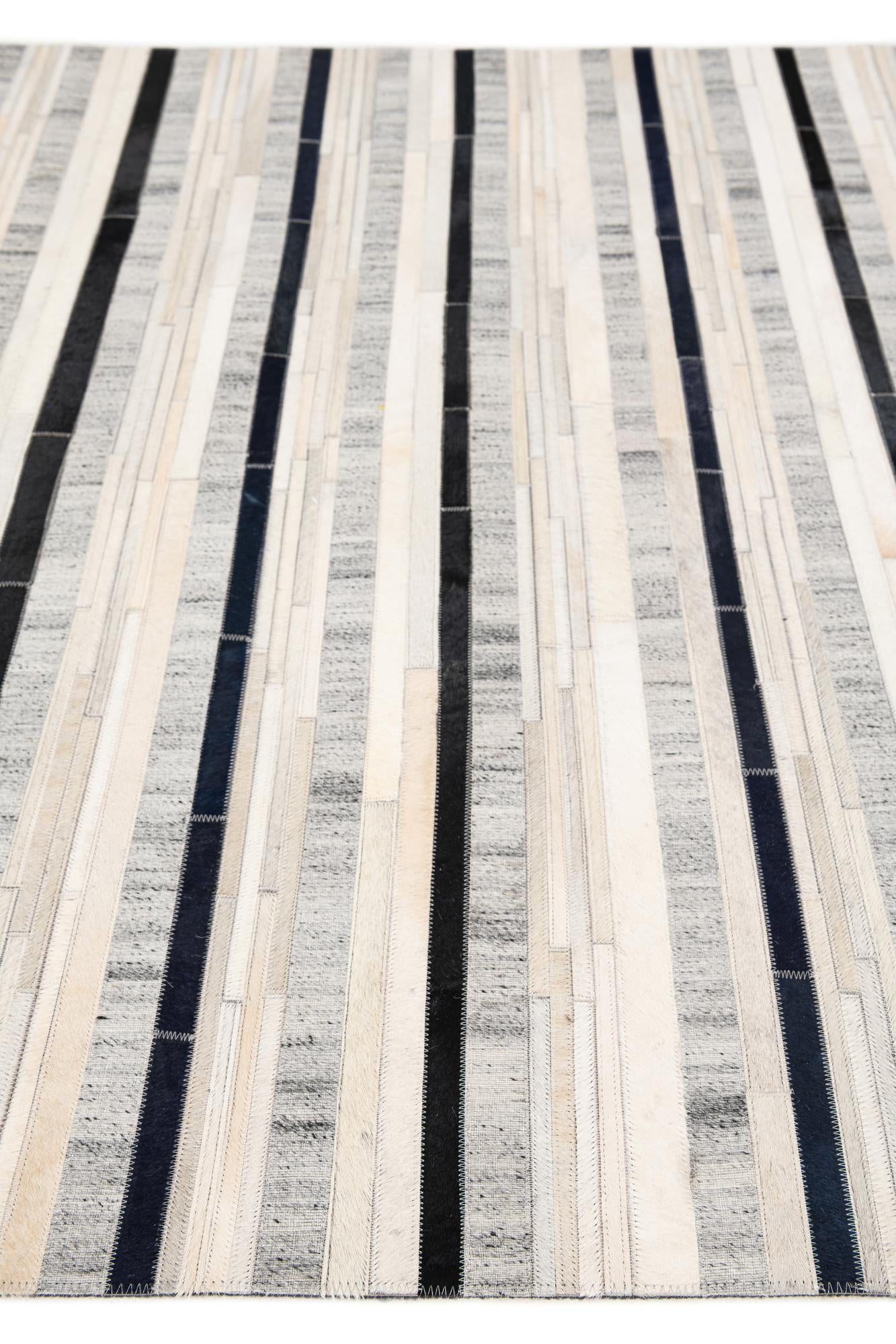 5' 1 x 7' 10 Cowhide Stocks Rug