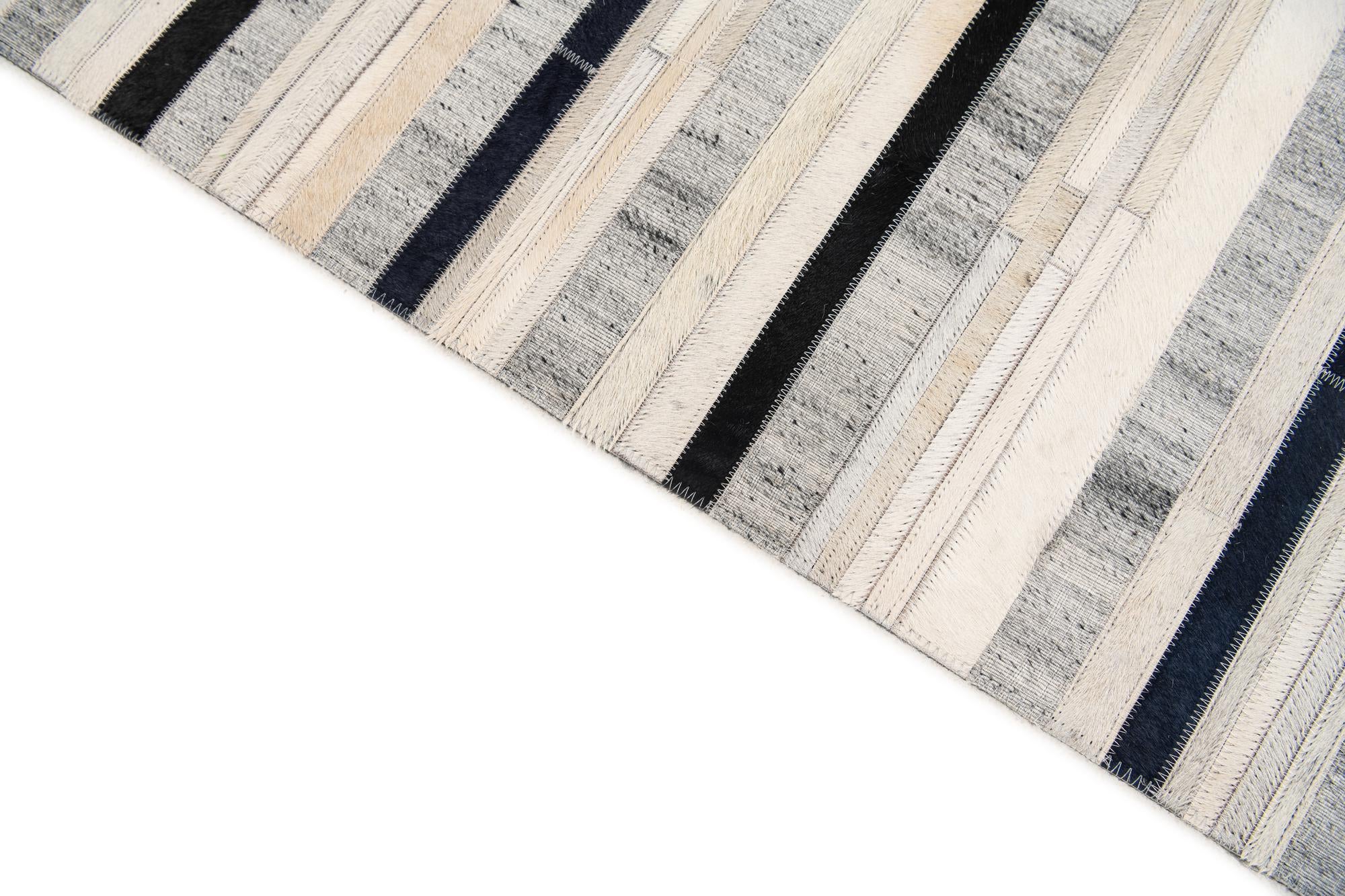 5' 1 x 7' 10 Cowhide Stocks Rug