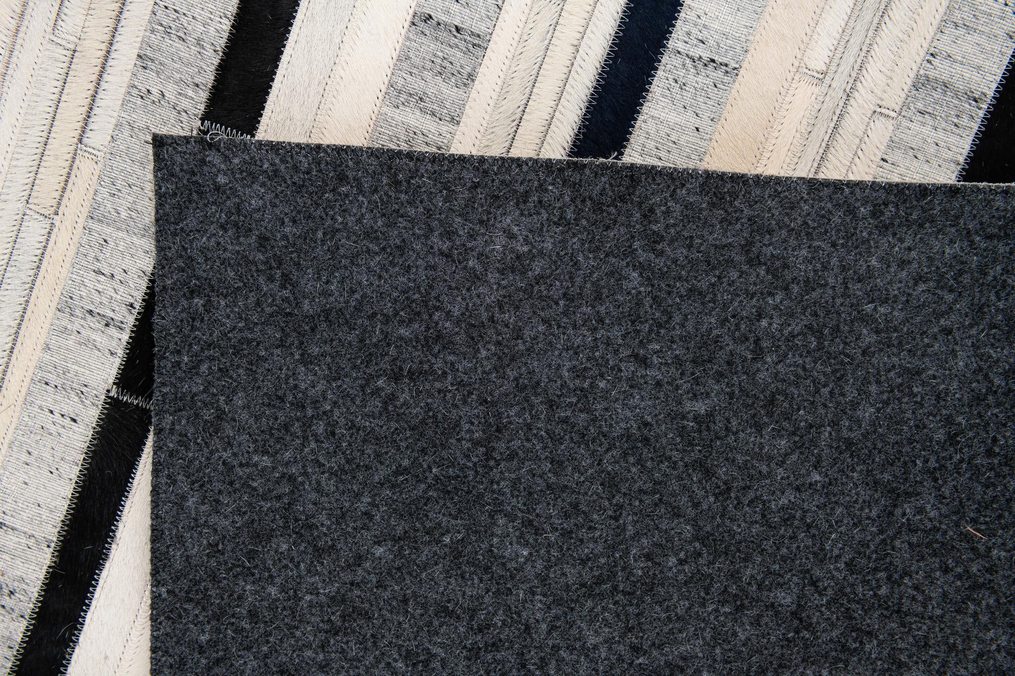 5' 1 x 7' 10 Cowhide Stocks Rug