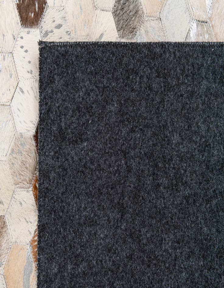 Detail image of 5' x 7' 11 Cowhide Stocks Rug