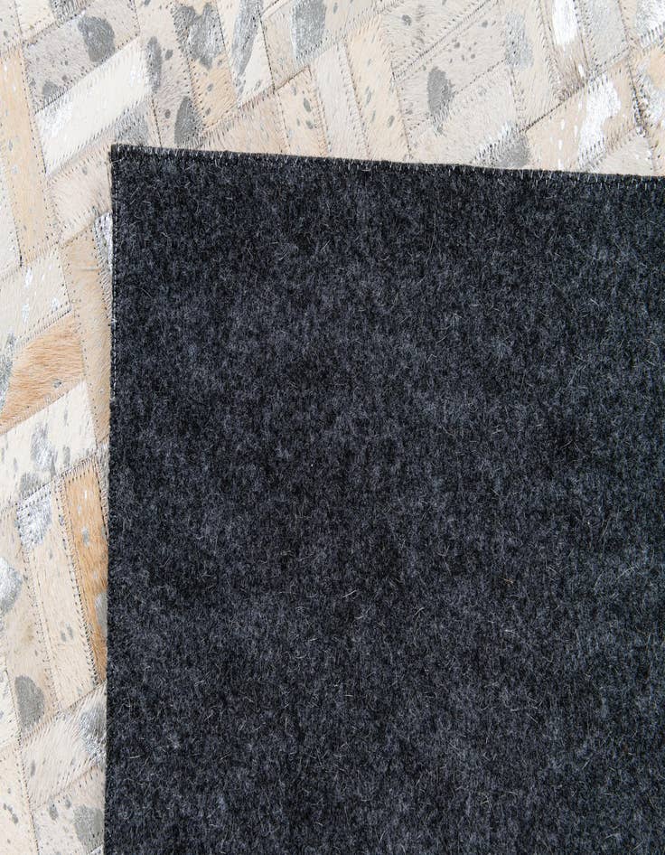 Detail image of 4' 11 x 8' 1 Cowhide Stocks Rug