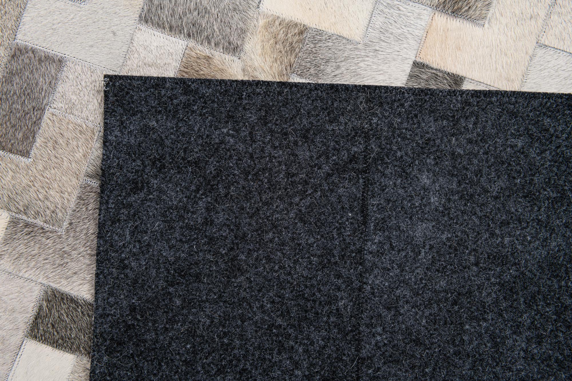 5' 7 x 7' 10 Cowhide Stocks Rug