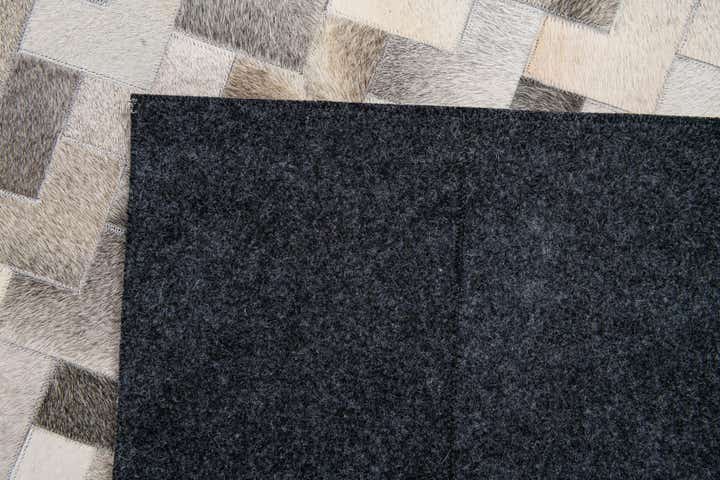5' 7 x 7' 10 Cowhide Stocks Rug