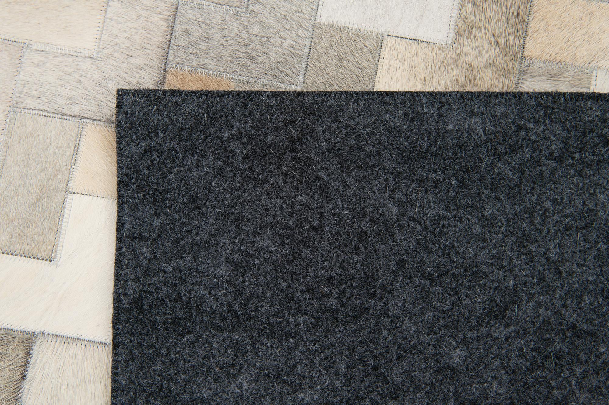 5' 7 x 7' 10 Cowhide Stocks Rug