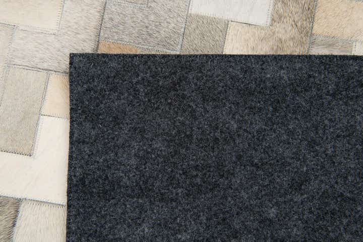 5' 7 x 7' 10 Cowhide Stocks Rug