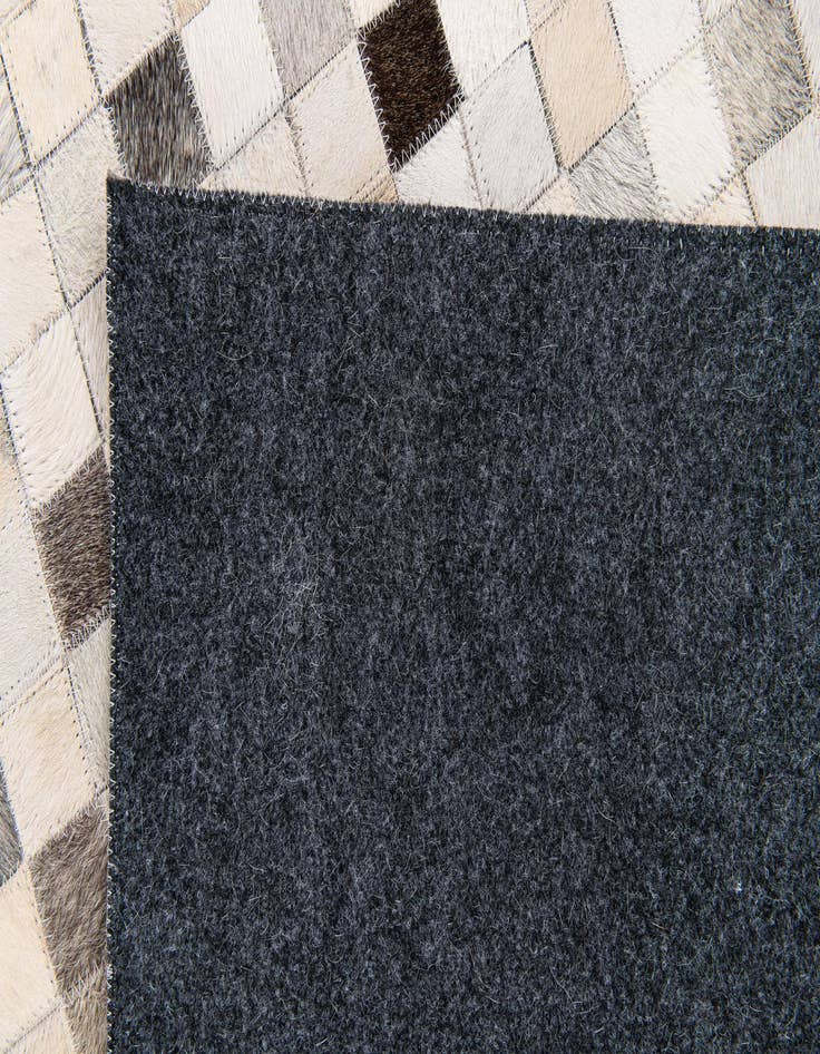 Detail image of 5' x 7' 11 Cowhide Stocks Rug