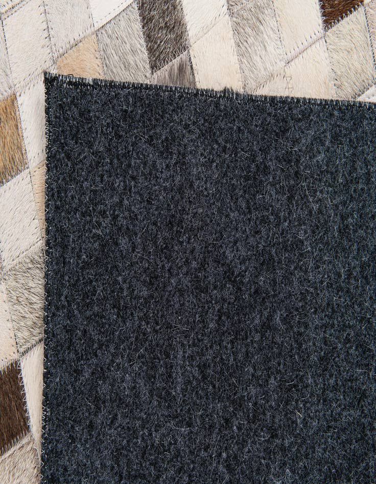 Detail image of 5' x 7' 11 Cowhide Stocks Rug