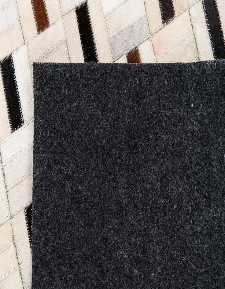 Detail image of 5' 1 x 8' Cowhide Stocks Rug