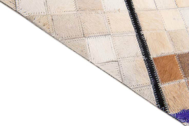 Detail image of 5' x 7' 11 Cowhide Stocks Rug