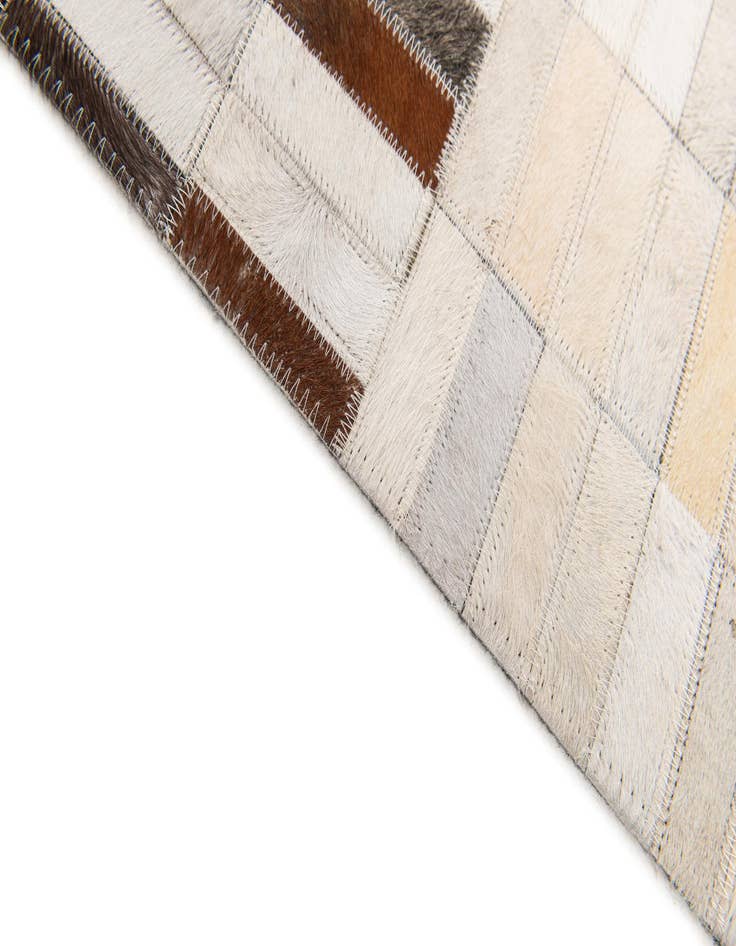 Detail image of 5' x 7' 11 Cowhide Stocks Rug