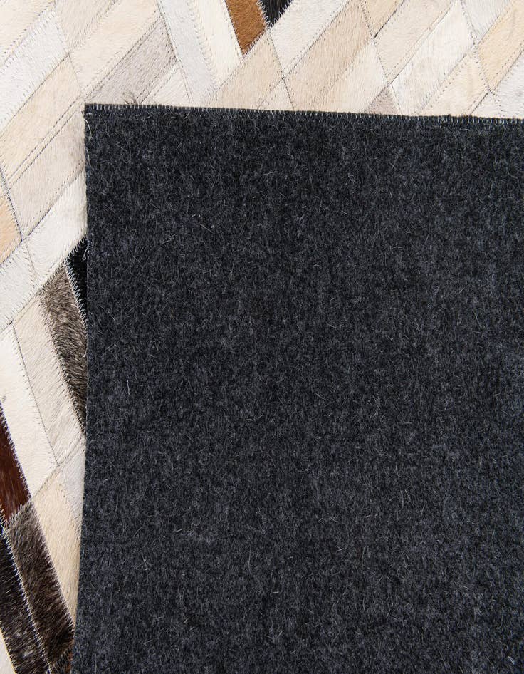 Detail image of 5' x 7' 11 Cowhide Stocks Rug