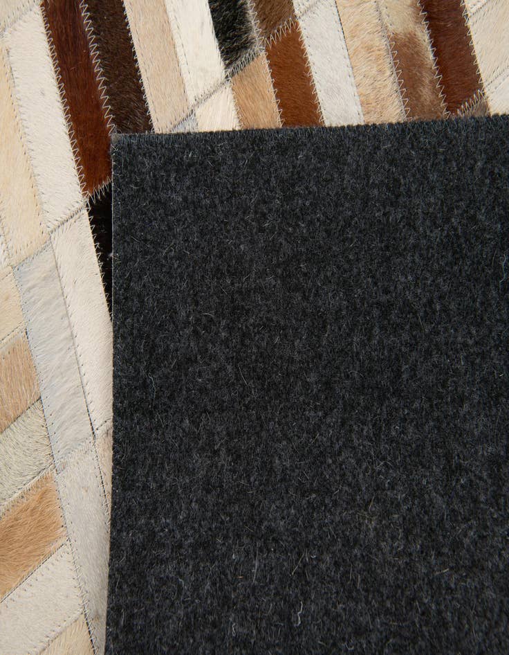 Detail image of 5' x 7' 11 Cowhide Stocks Rug