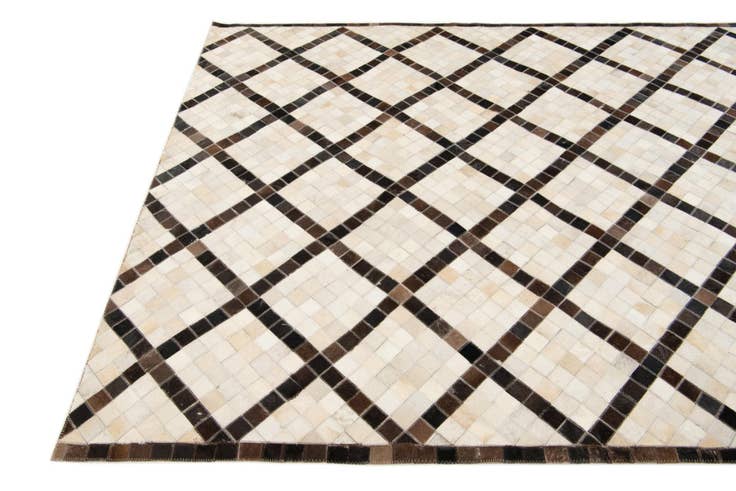 Detail image of 5' 2 x 8' Cowhide Stocks Rug