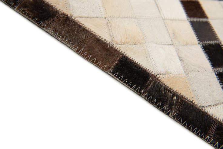Detail image of 5' 2 x 8' Cowhide Stocks Rug
