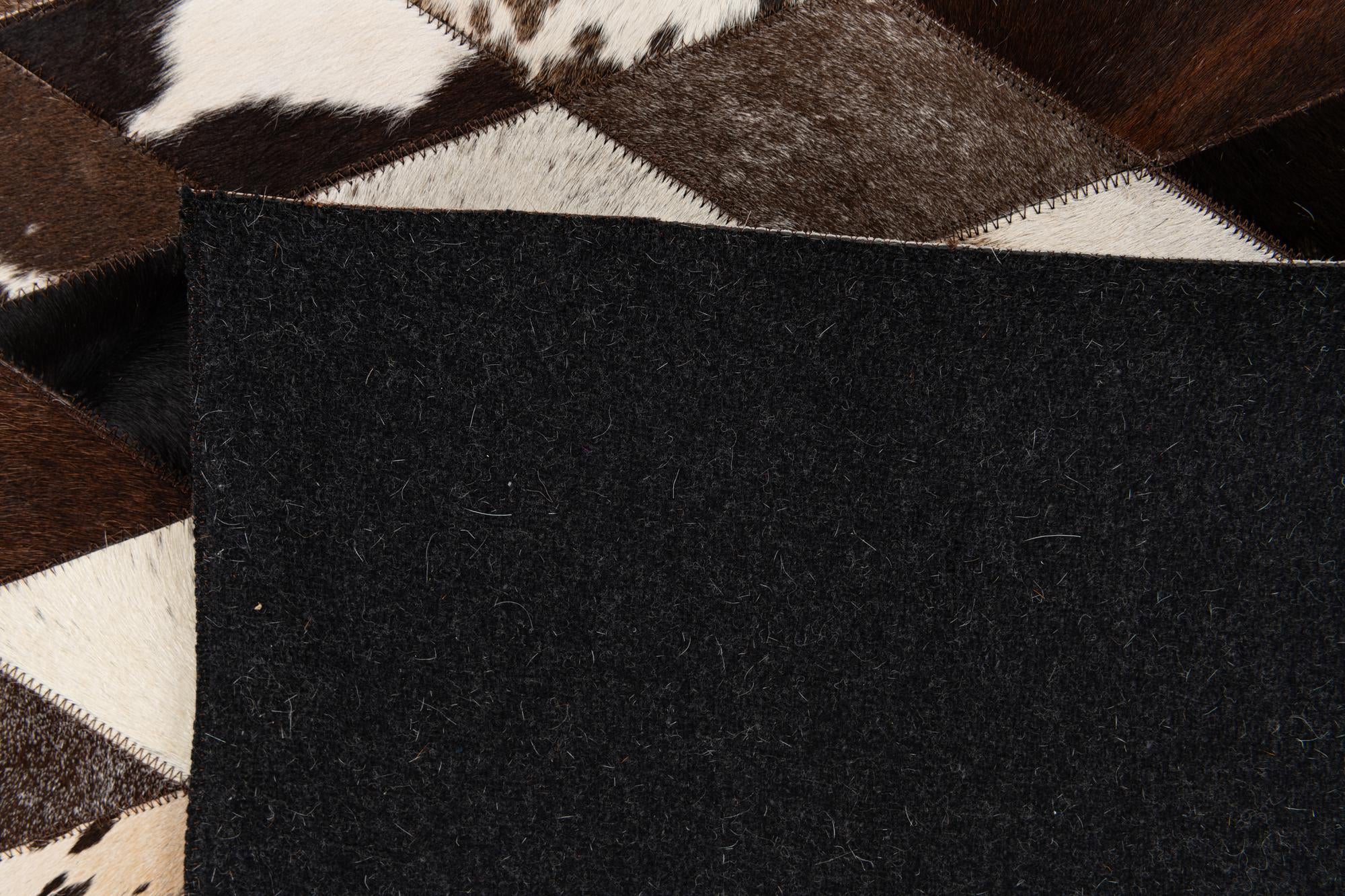 5' 2 x 8' 1 Cowhide Stocks Rug