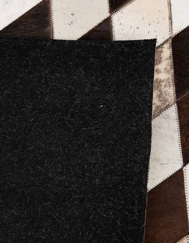 Detail image of 5' 2 x 8' 1 Cowhide Stocks Rug