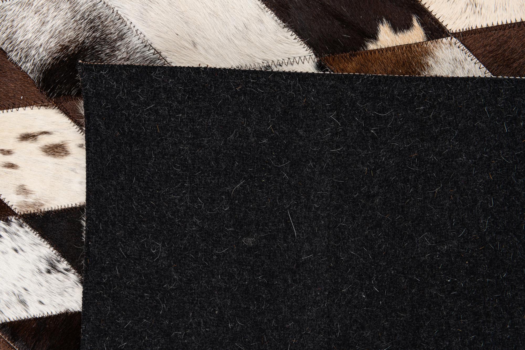 5' 2 x 8' 1 Cowhide Stocks Rug