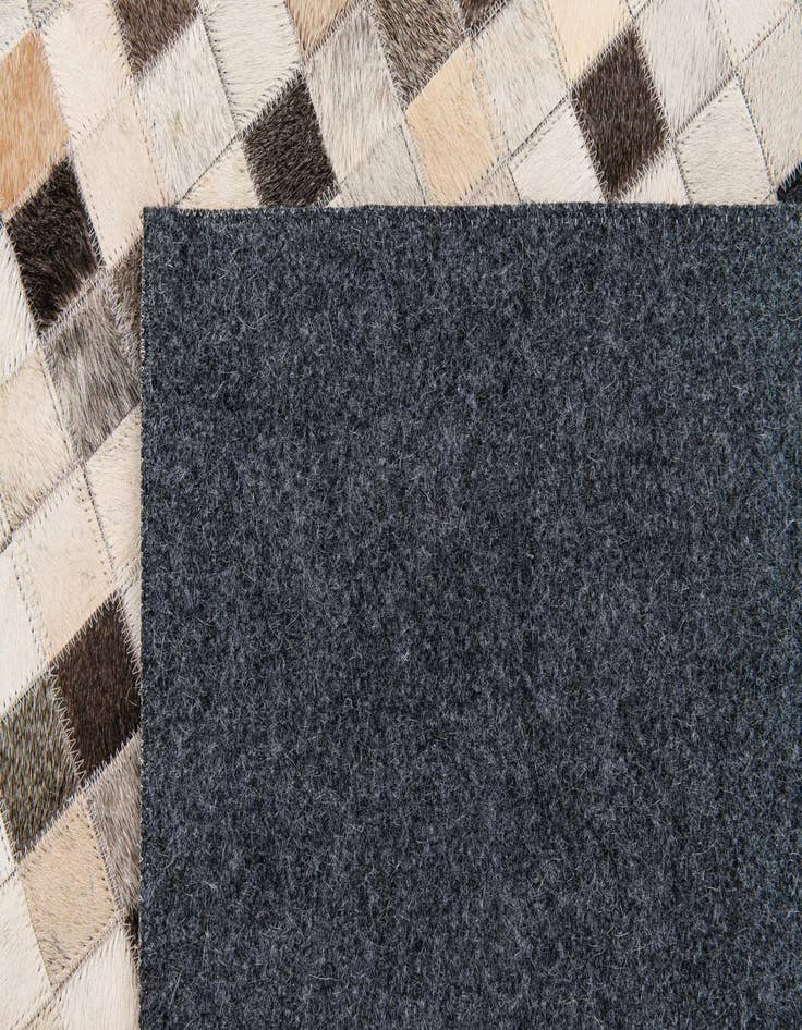 Detail image of 5' 2 x 8' Cowhide Stocks Rug