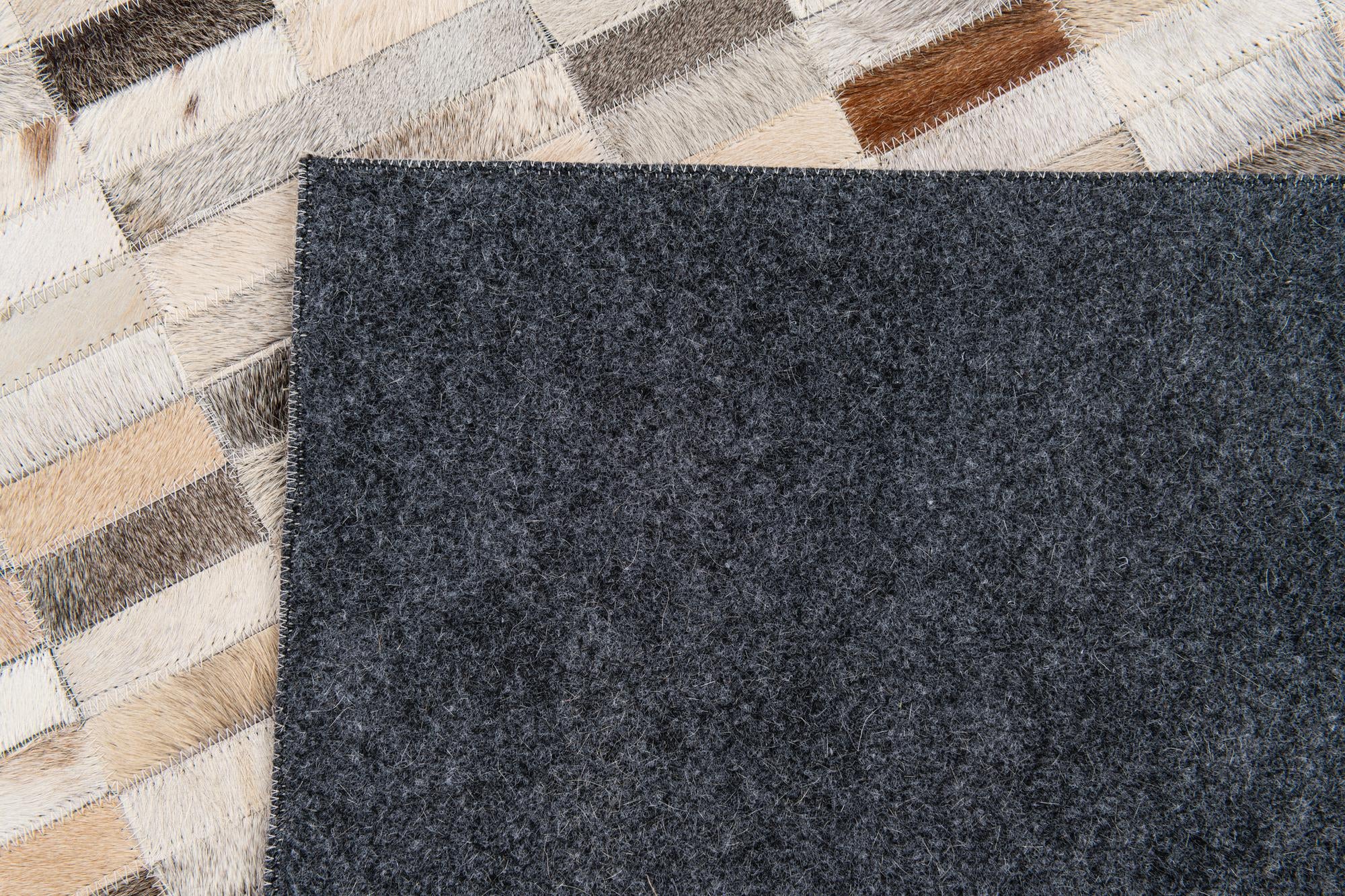5' 1 x 7' 10 Cowhide Stocks Rug