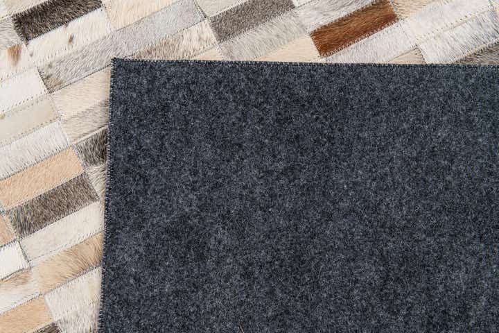 5' 1 x 7' 10 Cowhide Stocks Rug