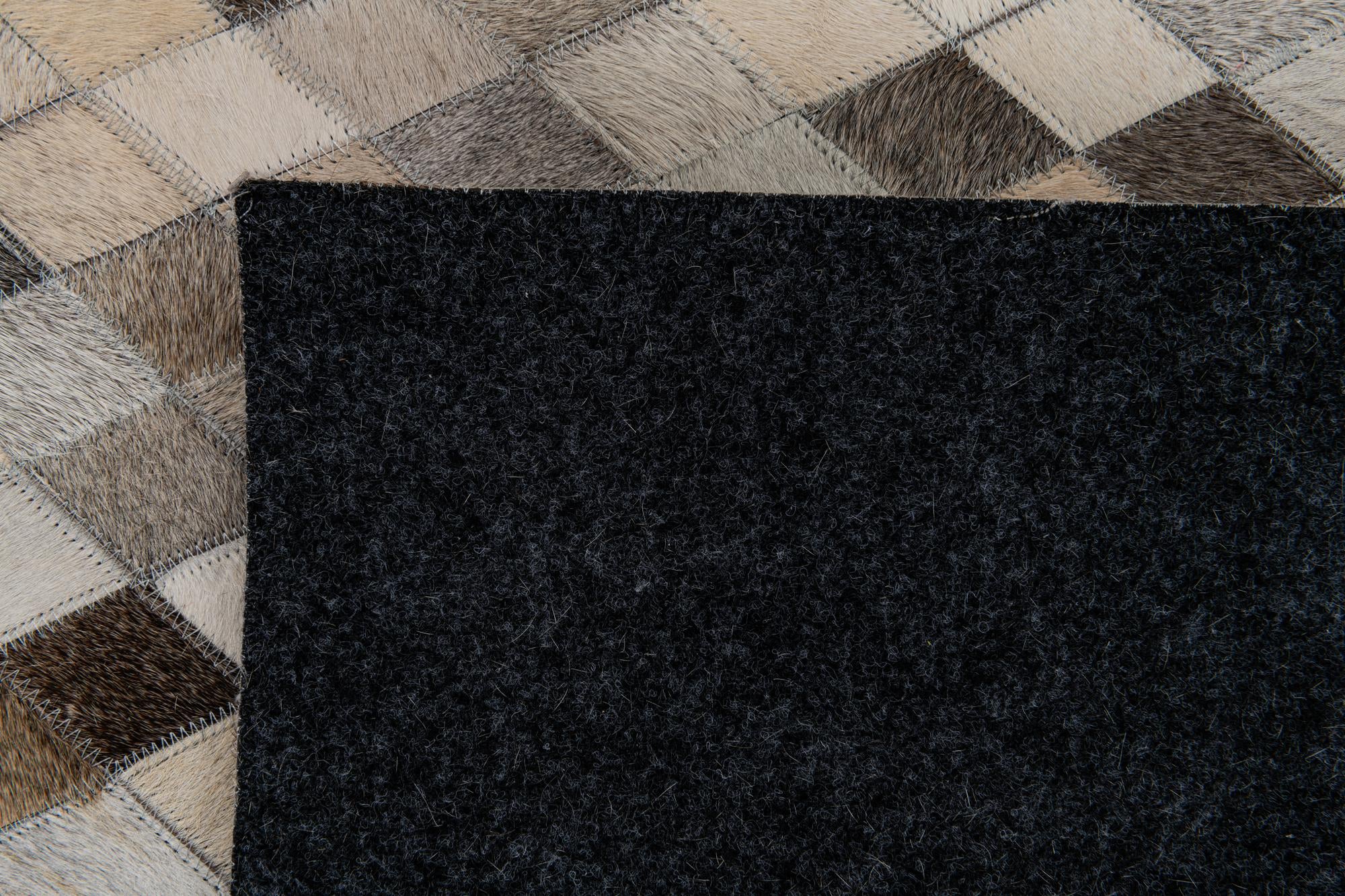 6' 7 x 9' 11 Cowhide Stocks Rug