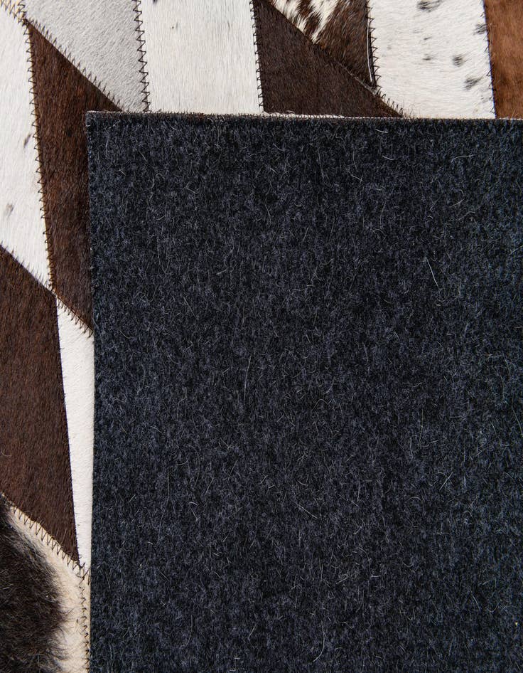 Detail image of 4' 8 x 6' 9 Cowhide Stocks Rug