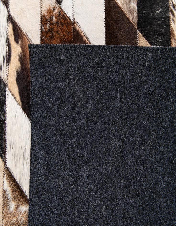 Detail image of 4' 8 x 6' 9 Cowhide Stocks Rug