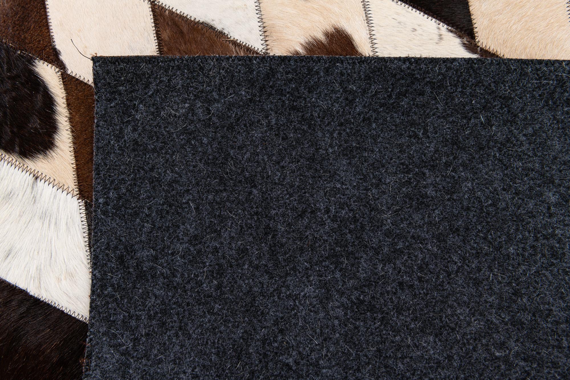 4' 8 x 6' 9 Cowhide Stocks Rug