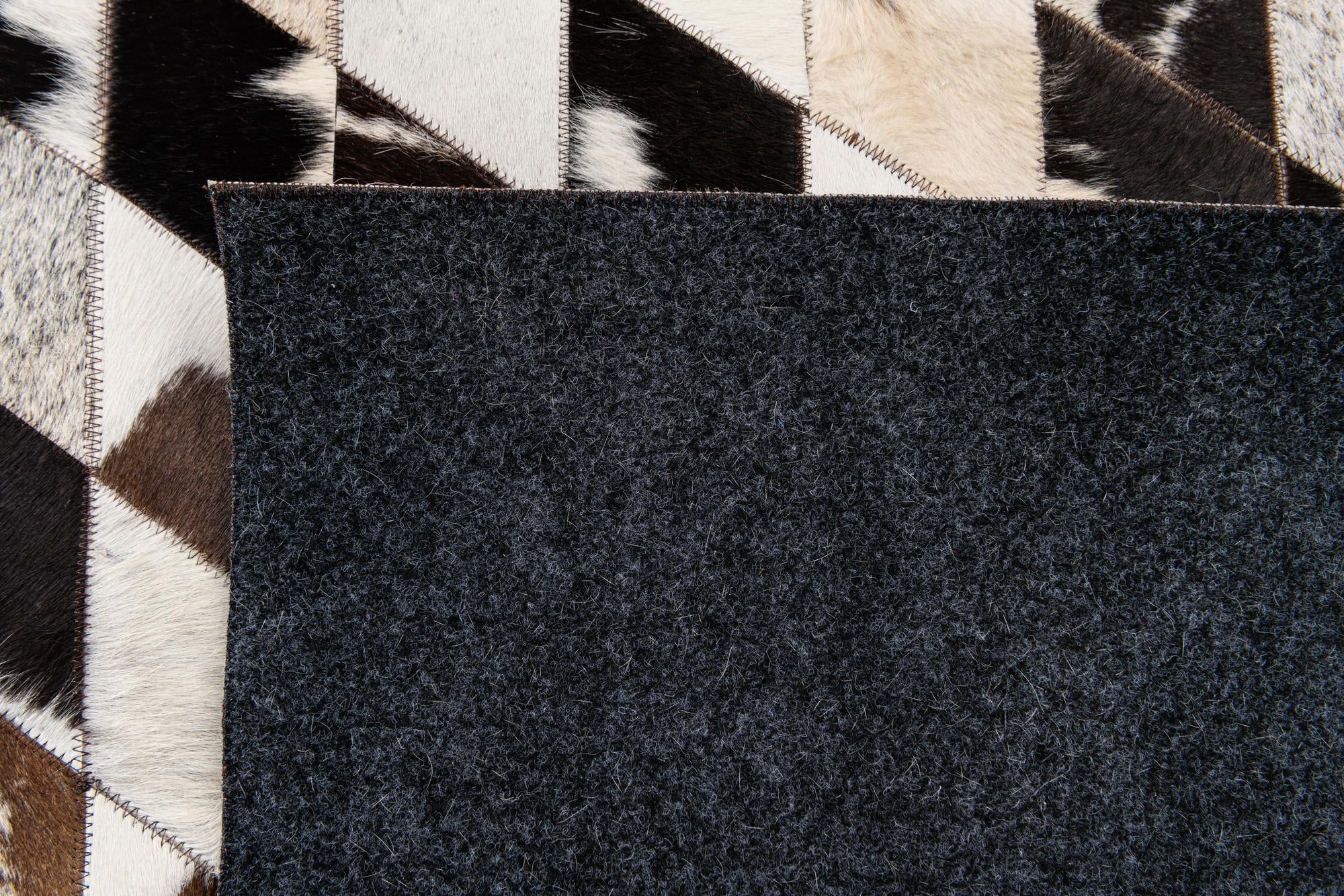 4' 8 x 6' 8 Cowhide Stocks Rug