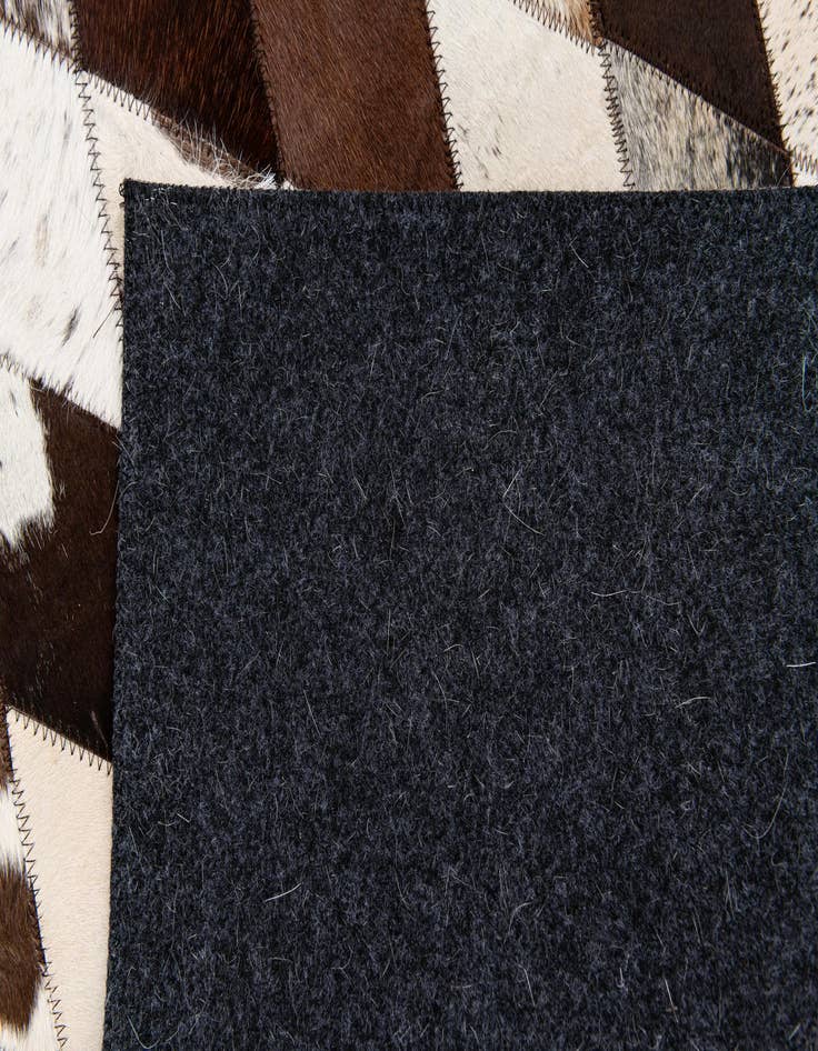 Detail image of 4' 9 x 6' 9 Cowhide Stocks Rug