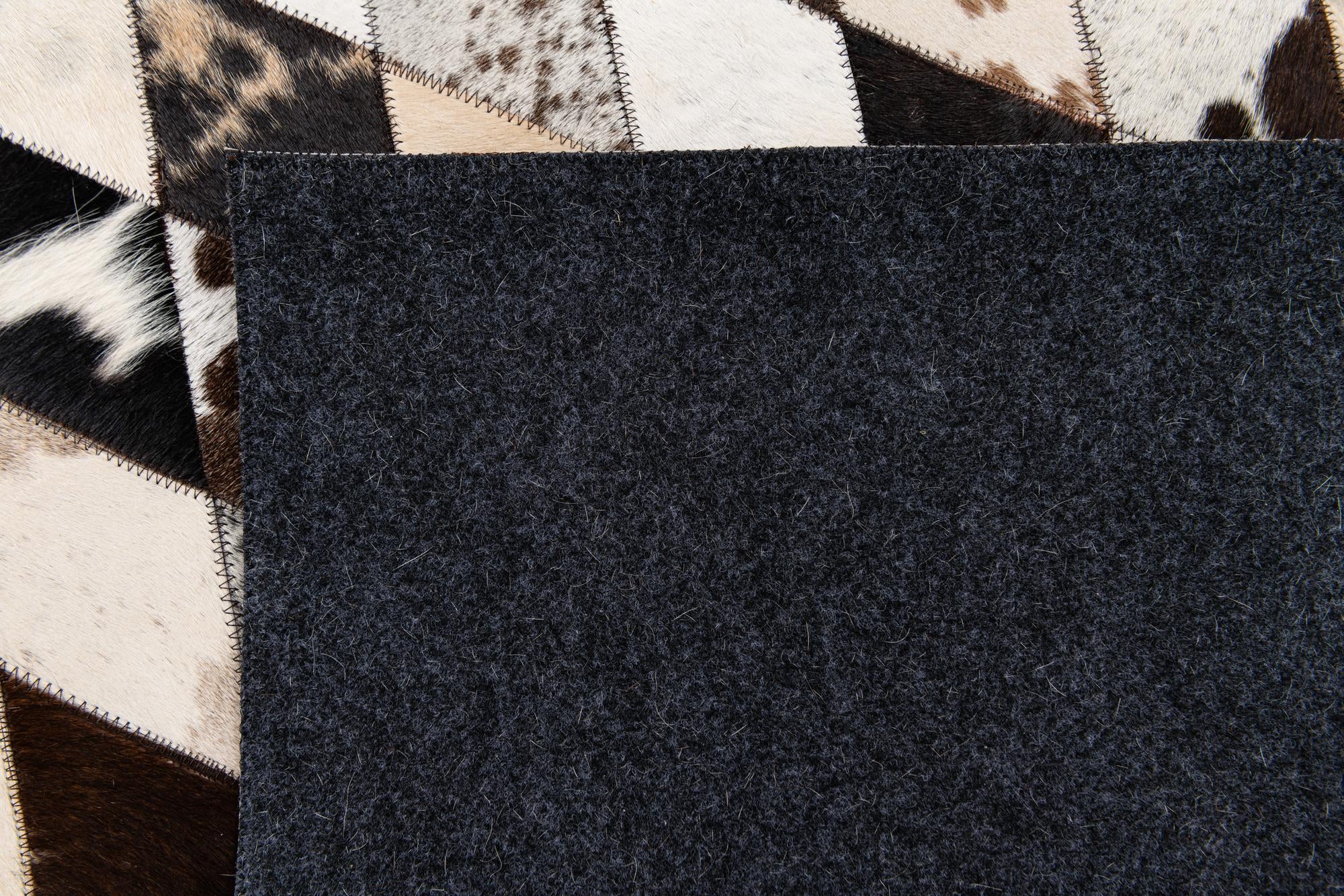 4' 8 x 6' 9 Cowhide Stocks Rug