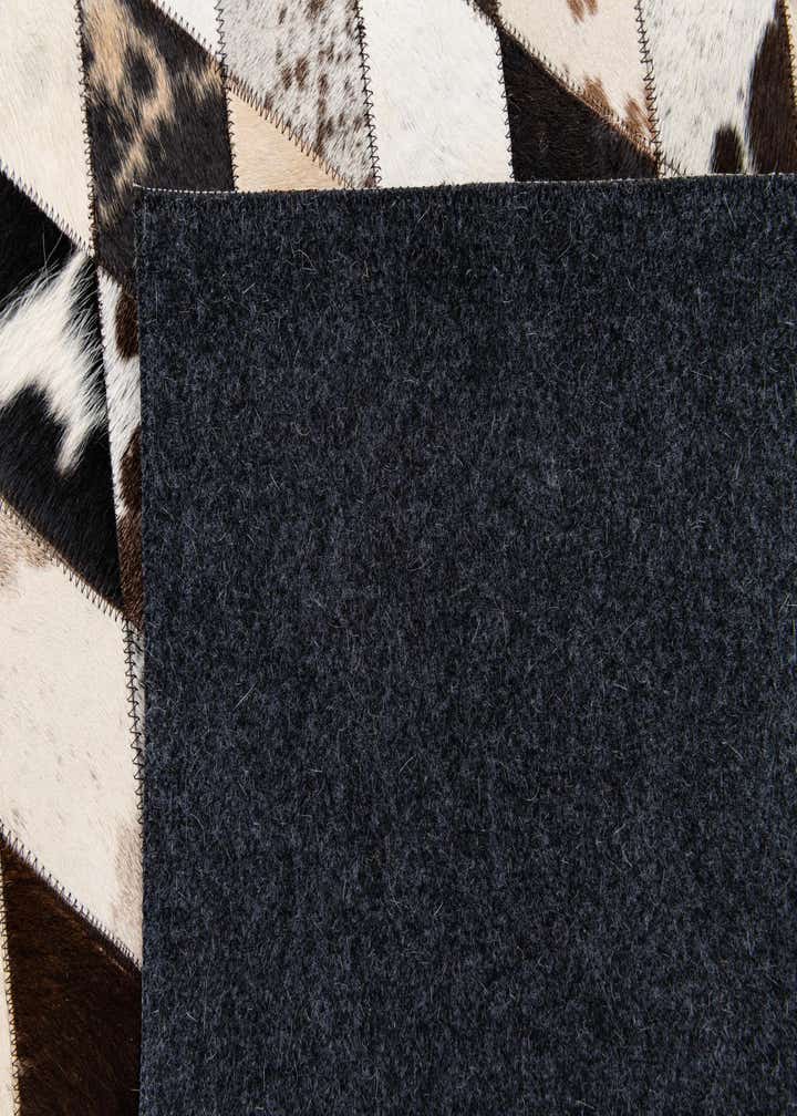 4' 8 x 6' 9 Cowhide Stocks Rug
