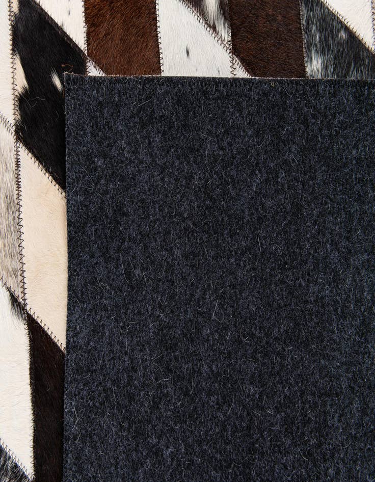 Detail image of 4' 8 x 6' 9 Cowhide Stocks Rug