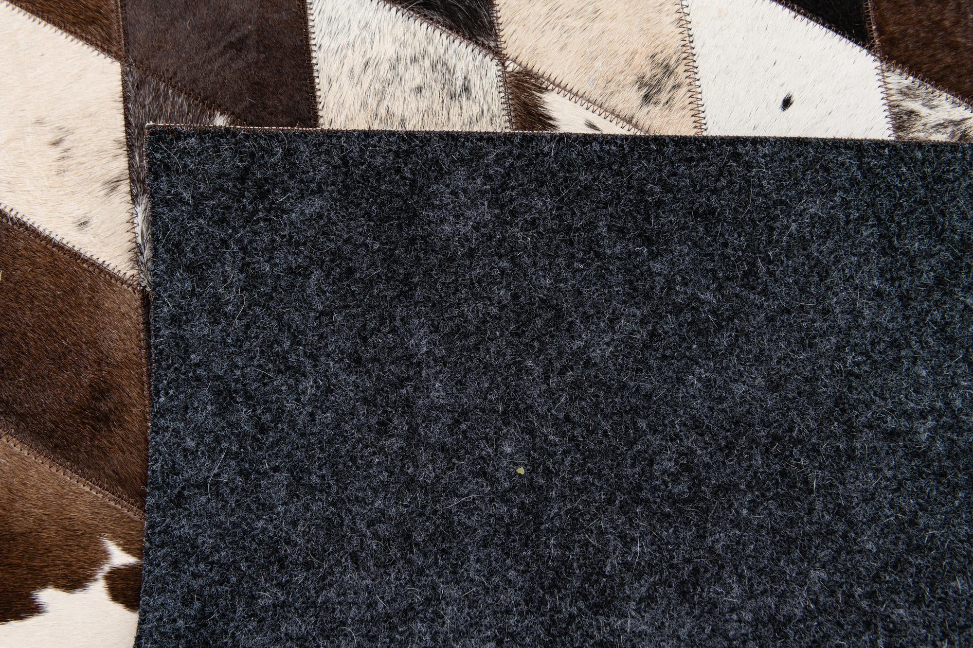 4' 8 x 6' 9 Cowhide Stocks Rug