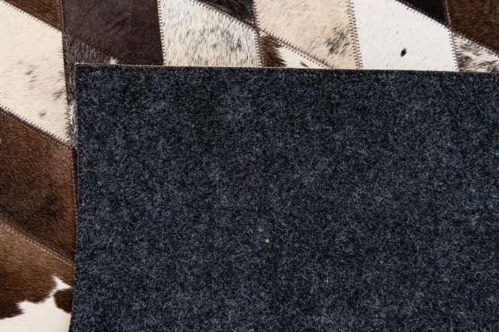 4' 8 x 6' 9 Cowhide Stocks Rug