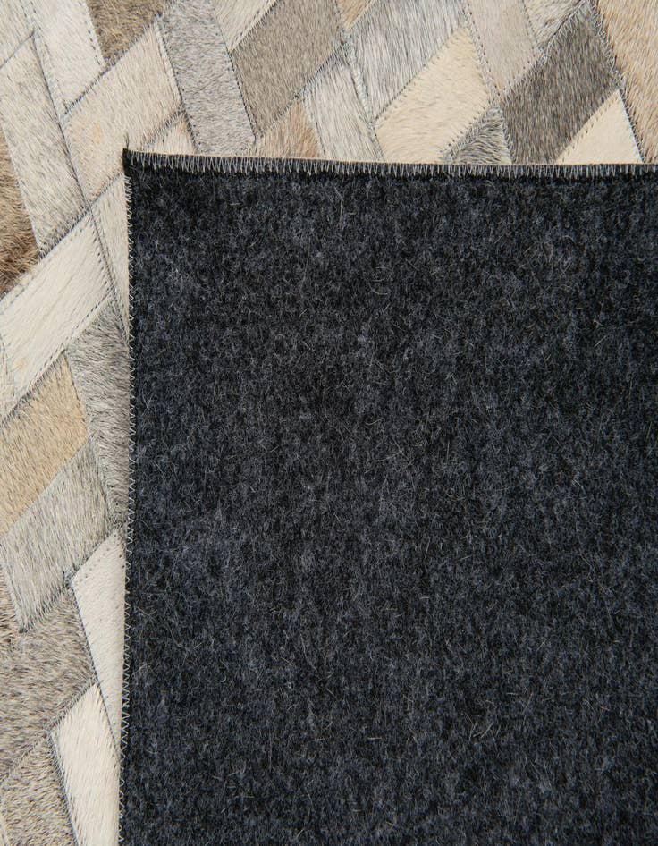 Detail image of 4' 7 x 6' 6 Cowhide Stocks Rug