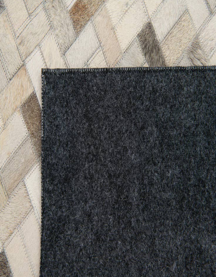 Detail image of 4' 7 x 6' 6 Cowhide Stocks Rug