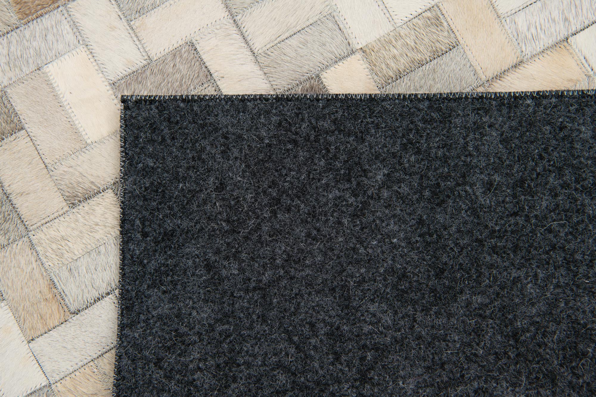 4' 8 x 6' 7 Cowhide Stocks Rug