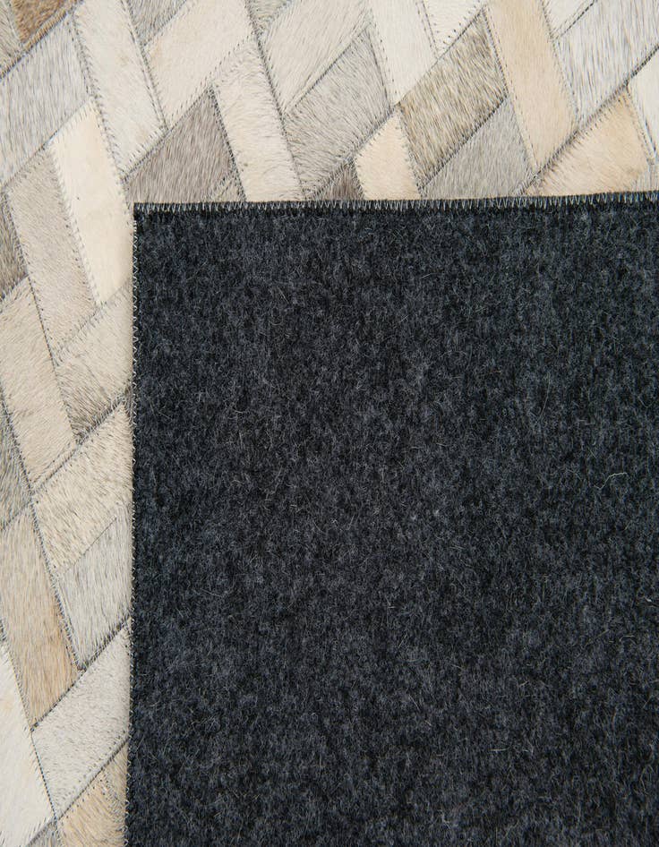 Detail image of 4' 8 x 6' 7 Cowhide Stocks Rug