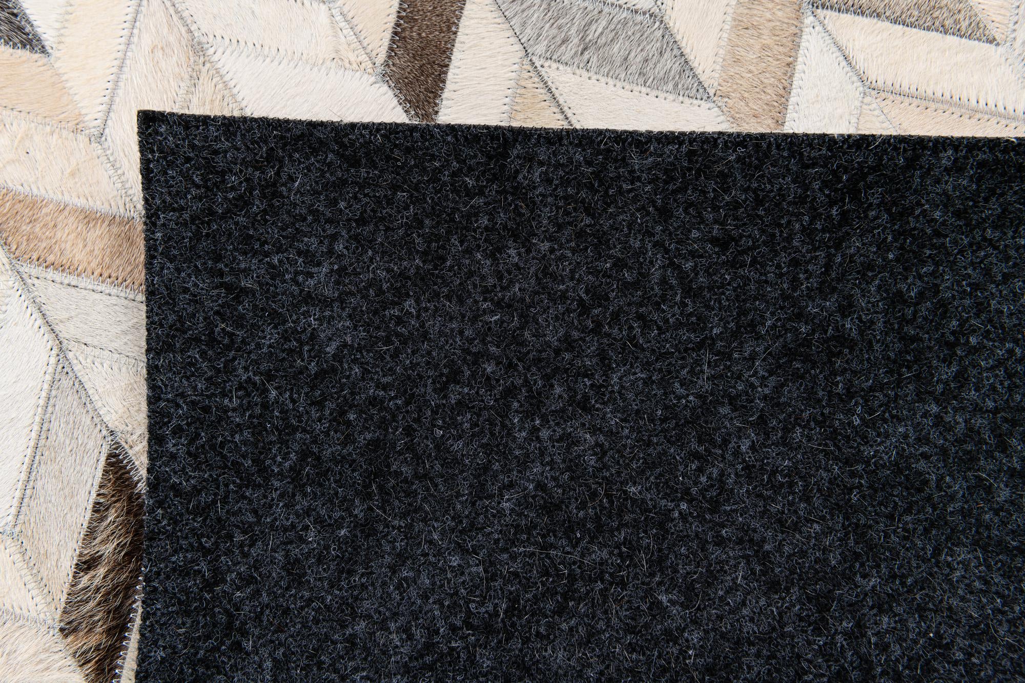 4' 8 x 6' 7 Cowhide Stocks Rug