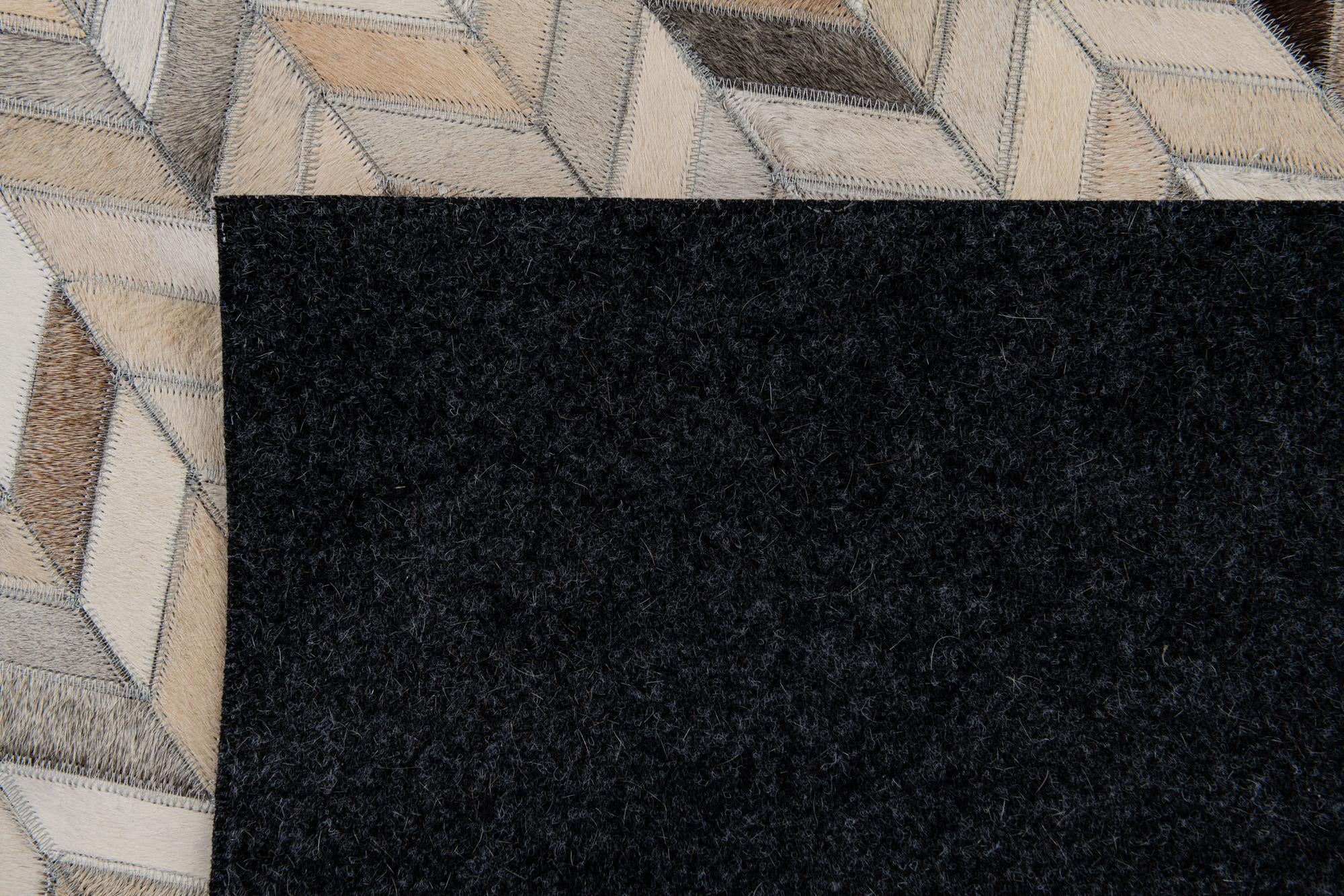 4' 8 x 6' 7 Cowhide Stocks Rug