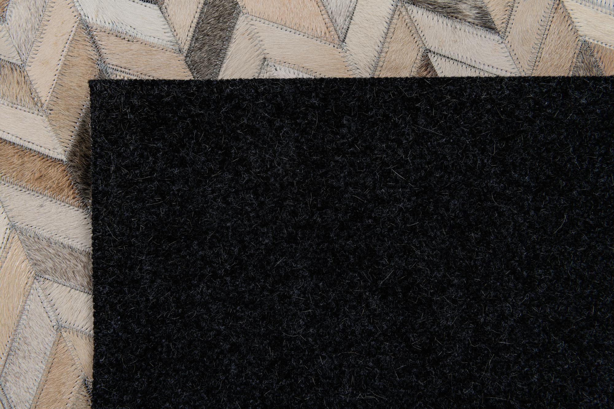 4' 8 x 6' 7 Cowhide Stocks Rug