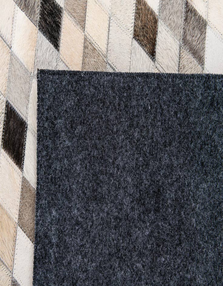 Detail image of 4' 7 x 6' 6 Cowhide Stocks Rug