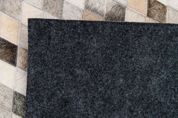 4' 8 x 6' 7 Cowhide Stocks Rug