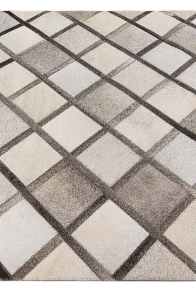 Detail image of 4' 1 x 6' 1 Cowhide Stocks Rug