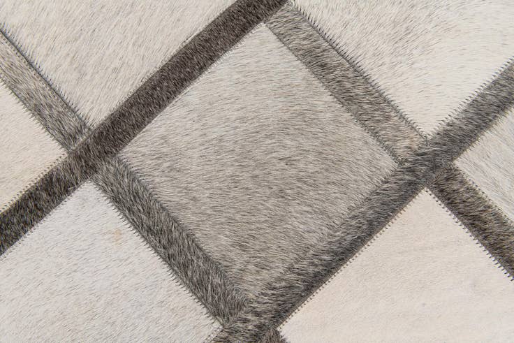 Detail image of 4' 1 x 6' 1 Cowhide Stocks Rug