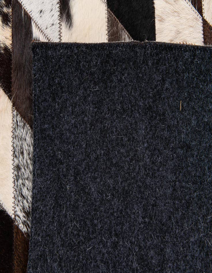 Detail image of 4' 1 x 5' 11 Cowhide Stocks Rug