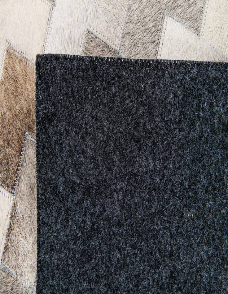 Detail image of 4' 1 x 5' 11 Cowhide Stocks Rug