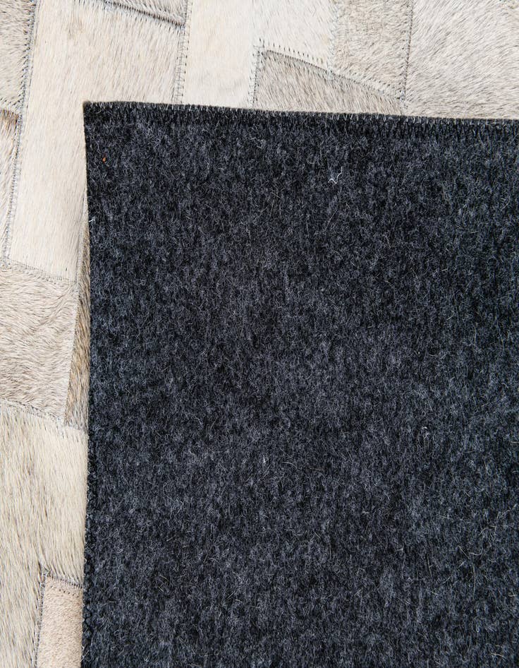Detail image of 4' 1 x 5' 11 Cowhide Stocks Rug
